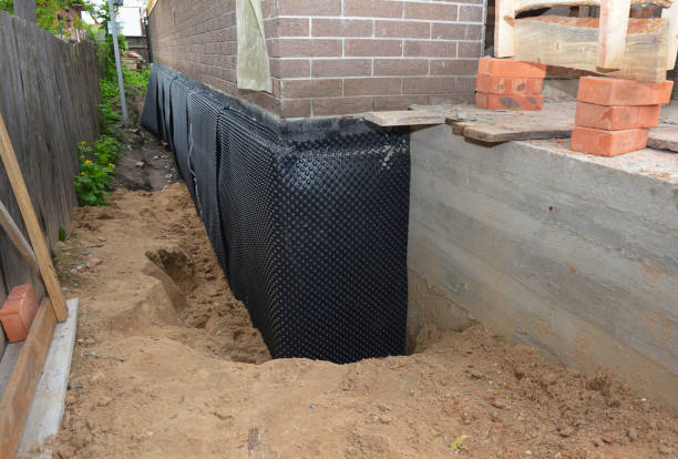 SJ Waterproofing Pros technician performing targeted Emergency Waterproofing assessment in Perdido, AL